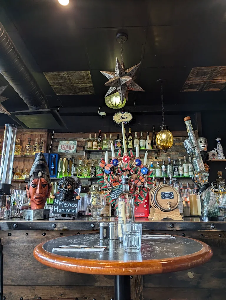 Churros with chocolate sauce dessert at Tacos Mexico Memorial Calgary