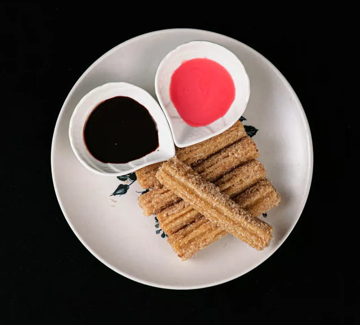 Churros with chocolate sauce at Tacos Mexico Memorial in Calgary, AB